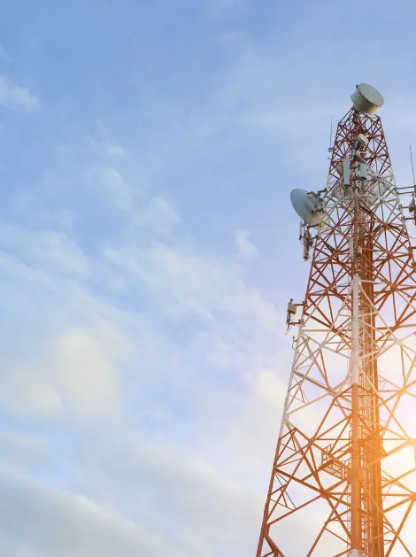 Broadcast transmission tower with satellite dishes.